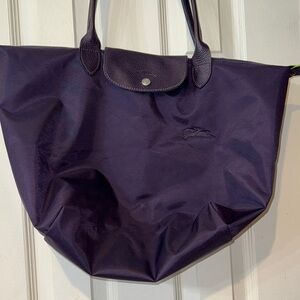 Long champ  Le Pliage in large, purple with lime green accents on side tabs.